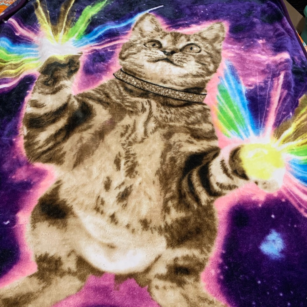 Throw blanket with cat on it